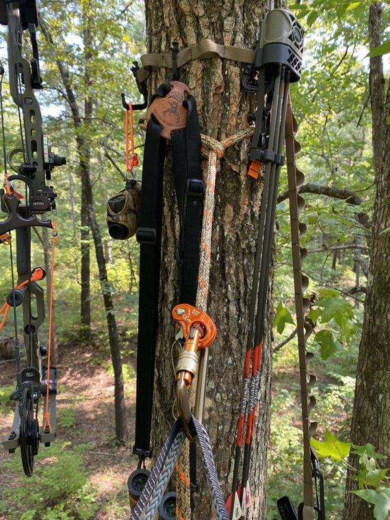 Photo of hunting gear arranged on tree while saddle hunting