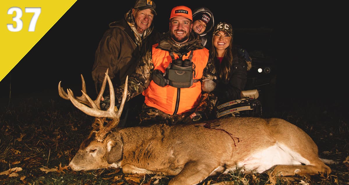 Photo of Michael Hunsucker and his family with a buck he harvested.