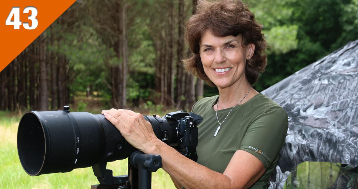 A photo of wildlife photographer Tes Jolly with her Nikon camera.