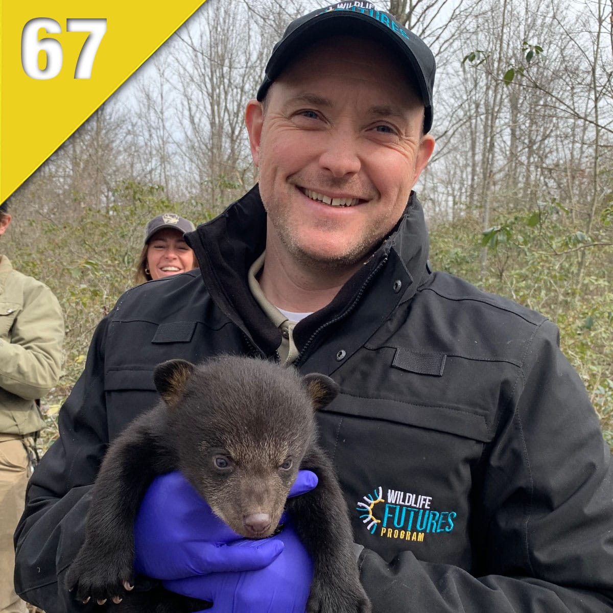 Penn Vet wildlife health technician Ian Gereg with a bear cub.